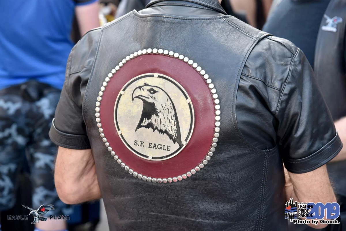 The S.F. Eagle eagle-head medallion on the back of a leather vest