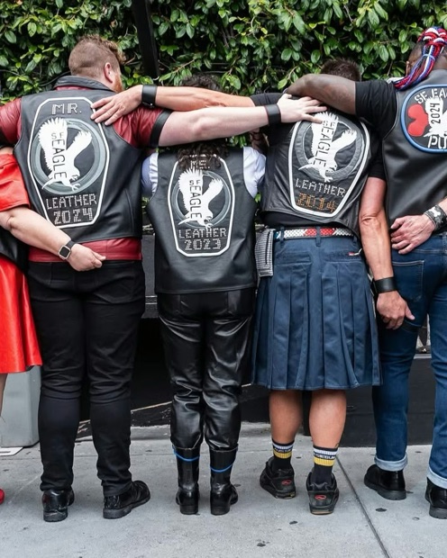 SF Eagle titleholders from behind in their SF Eagle Leather title vests